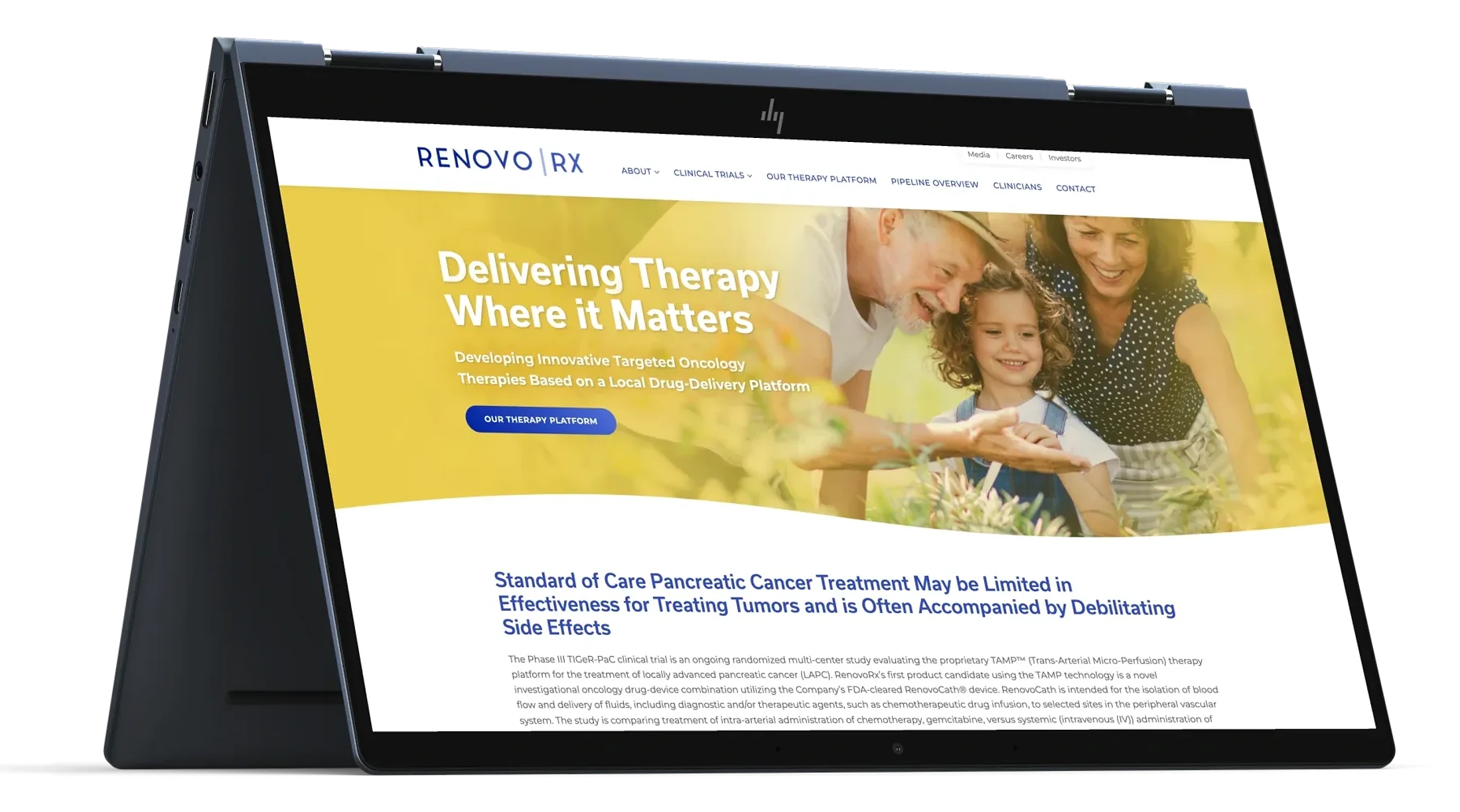 The RenovoRx homepage on a laptop: the line Delivering Therapy Where it Matters over warm family imagery.